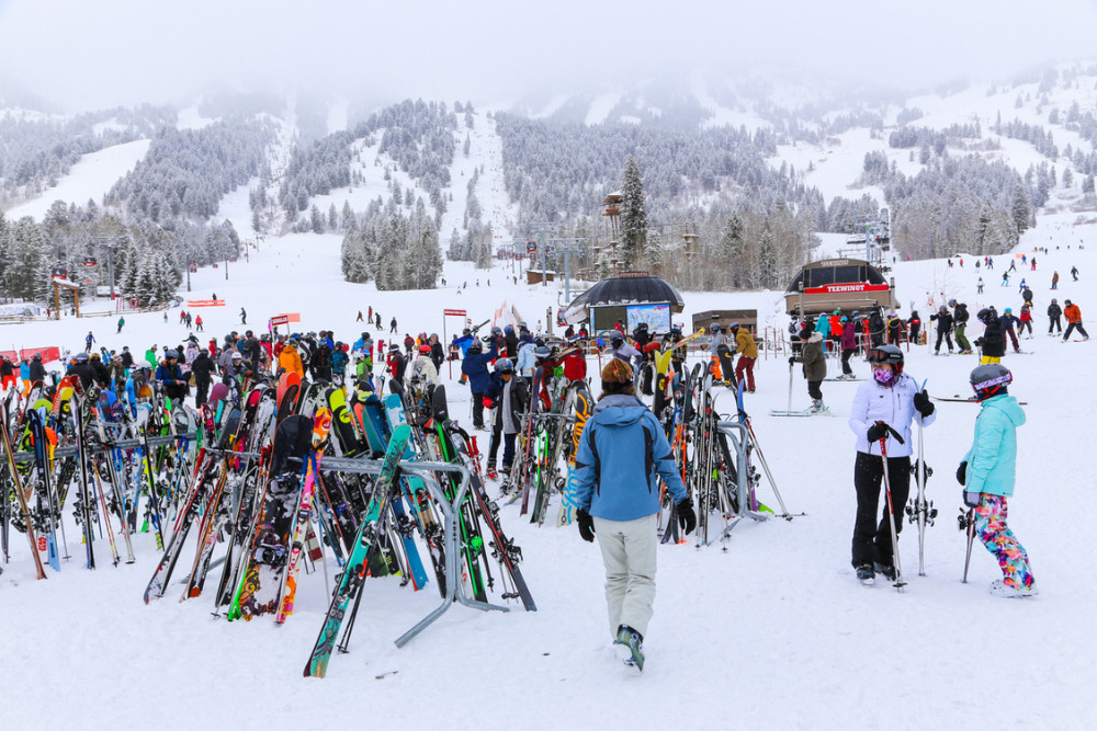 People and skis at the base of the Jackson Hole in Jackson, Wyoming.