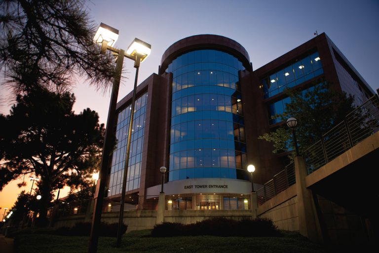 The windows of the North Mississippi Medical Center reflects the colors of the sky at dusk in Tupelo, MIssissippi.