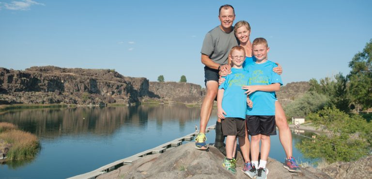 The Rothweiler family: Travis and Amy Rottweiler, and their sons, David (taller) and Jack (glasses) pose for portraits at Dierkes lake in Twin Falls, Idaho