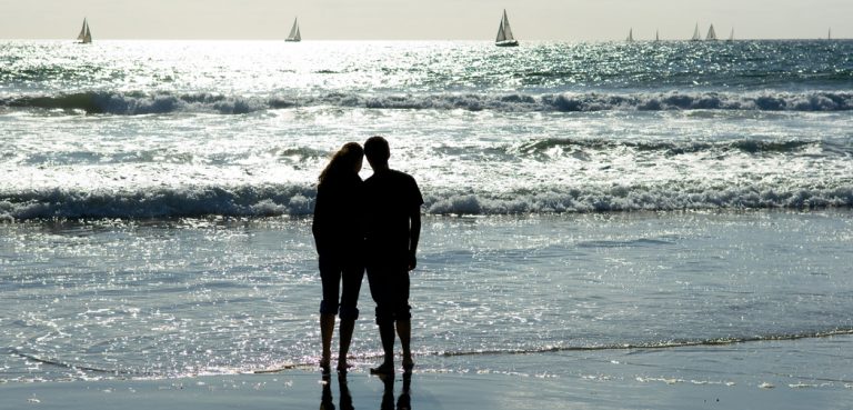 A couple enjoys the sunshine during a regatta off the coast of Venice Beach in Venice, California