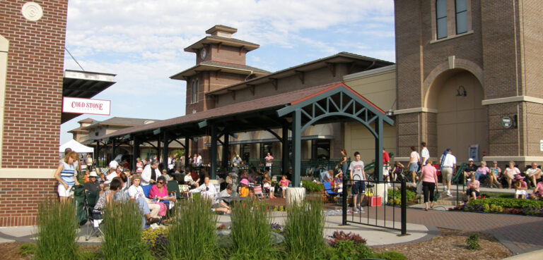 People mill around the Greenway Station Shopping Center in Middleton, WI