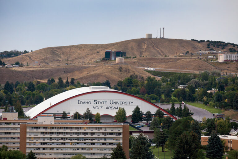 A view of Holt Arena on the Idaho State University Campus with a mountain the background.