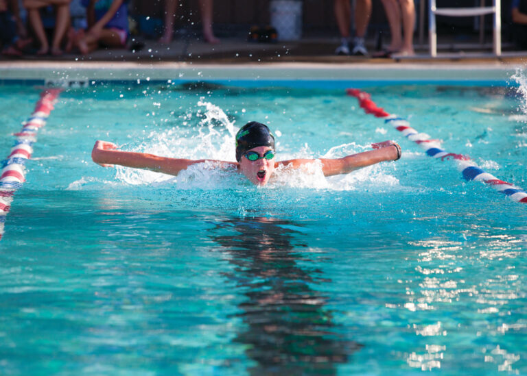 A swimmer from Prattville High School competes in a meet.