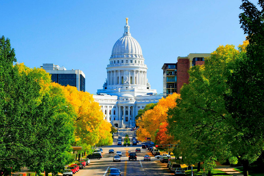 The Wisconsin state capitol looks beautiful among fall foliage in Madison
