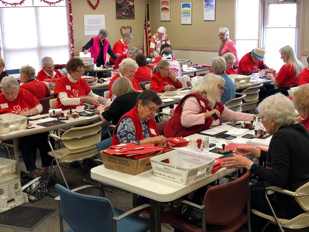 A volunteer group in Loveland, CO. Every year, thousands of valentines are re-routed through Loveland, a northern Colorado city that enthusiastically embraces its charming name. For two weeks leading up to Valentine’s Day, 50 volunteers — mostly retired folks — hand stamp cards that arrive from all over the world.