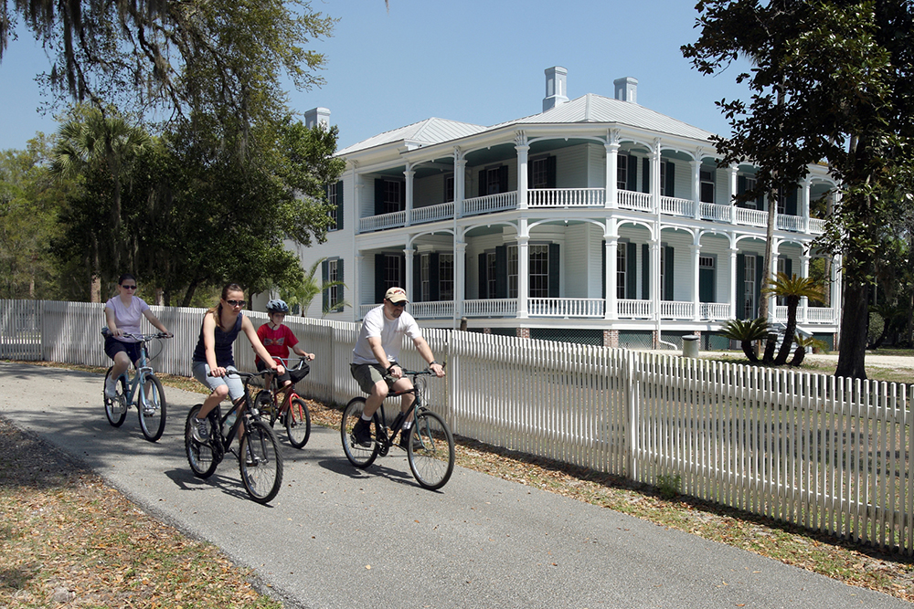 Family biking near DeBary Hall in Deland, FL