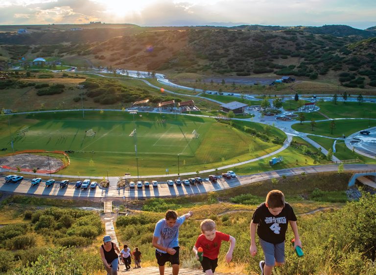 Aerial shot of people climbing up Challenge Hill at Philip S. Miller Park in Castle Rock, CO.