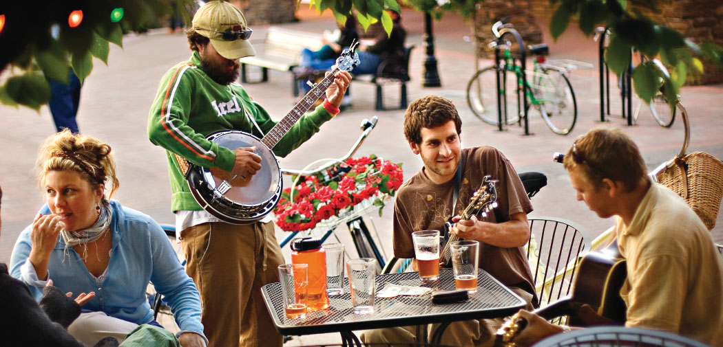 Visitors enjoy bluegrass and beers at Mirror Pond Plaza in Bend, Oregon.