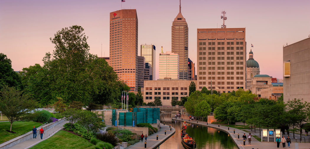 Tall buildings reach for the sky behind White River State Park in downtown Indianapolis.