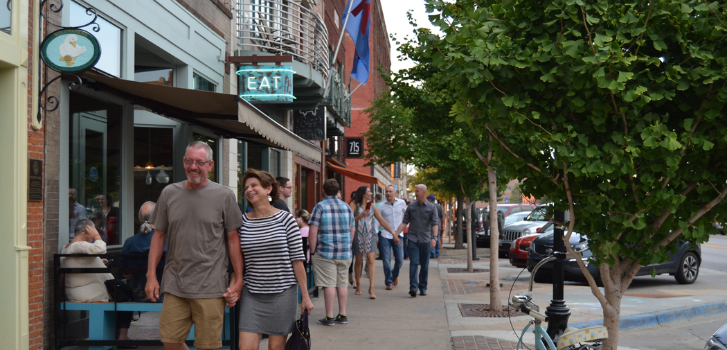 Residents stroll the streets in Lawrence, Kansas.
