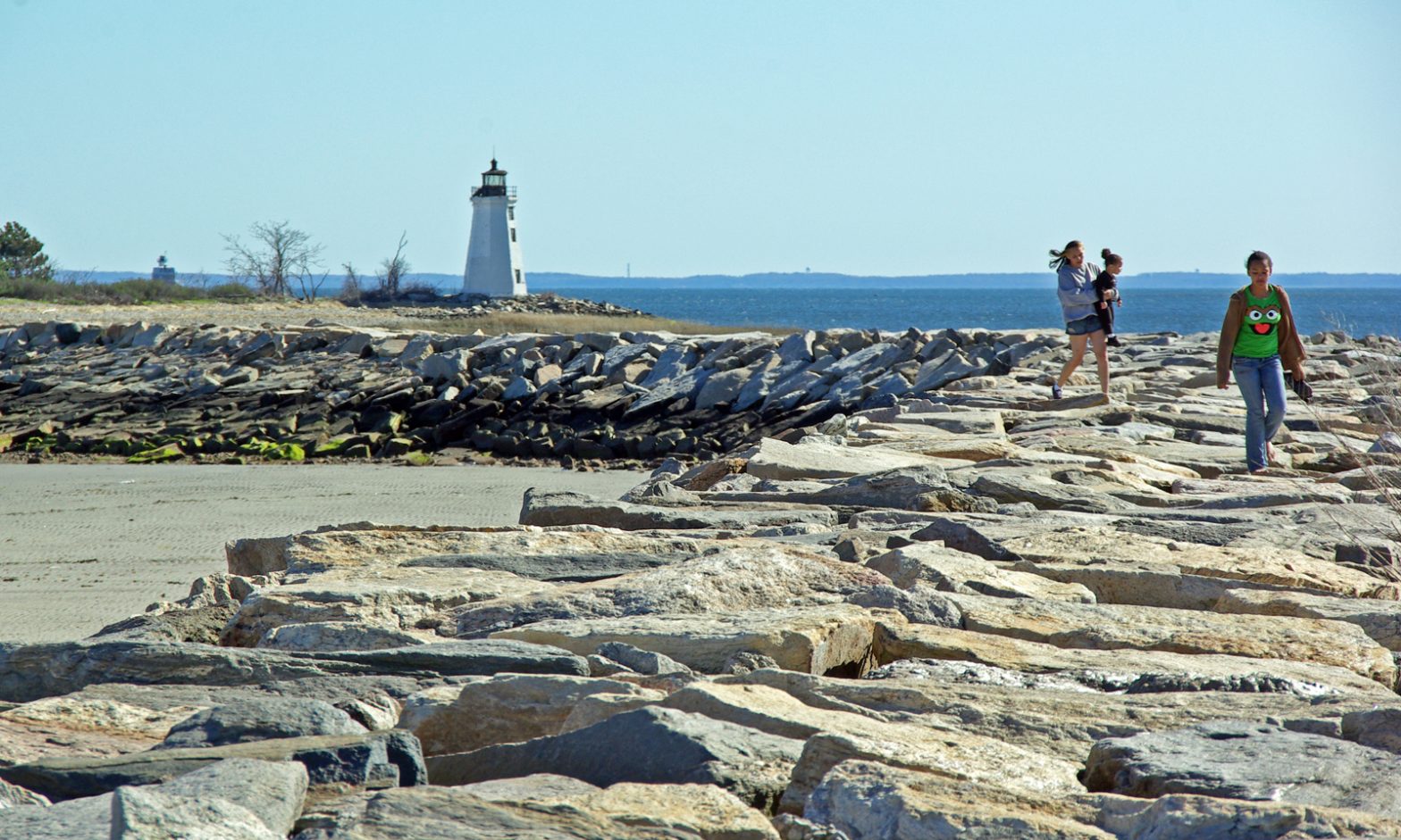 Visitors enjoy the Fayerweather Island Light in Bridgeport, Connecticut.