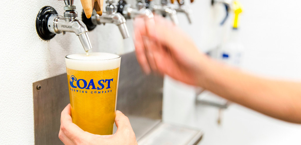 Beer being poured at Coast Brewing Company