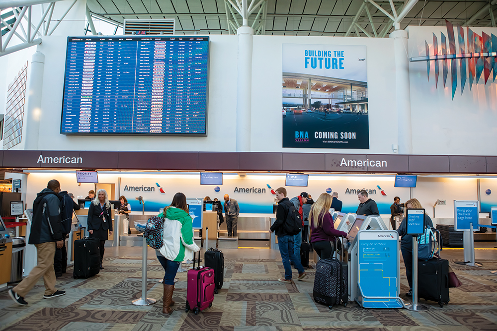 Passengers check in at Nashville International Airport