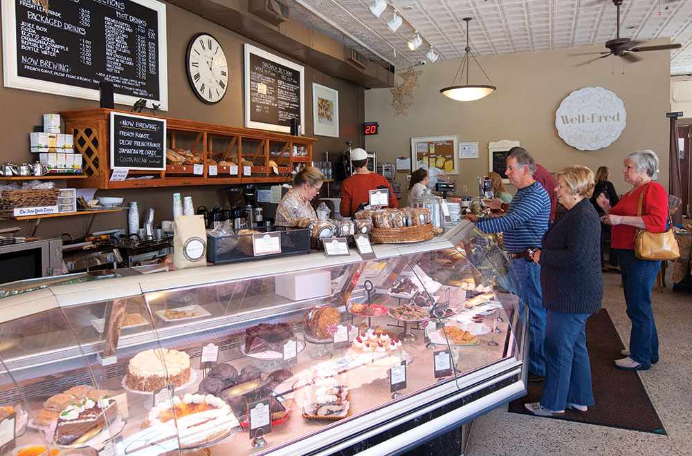 People lined up at the counter of Well-Bred Bakery & Café in Asheville NC