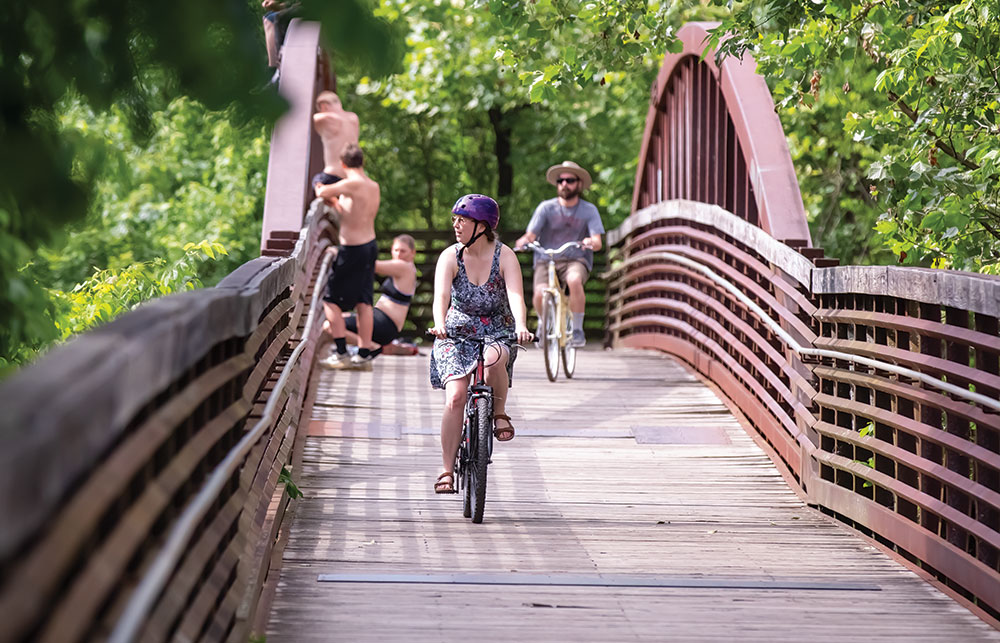 cyclists riding on greenway