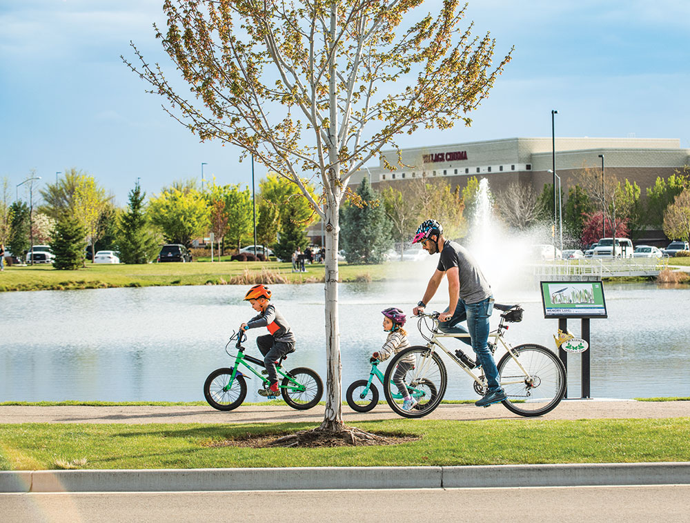 dad riding bikes with kids
