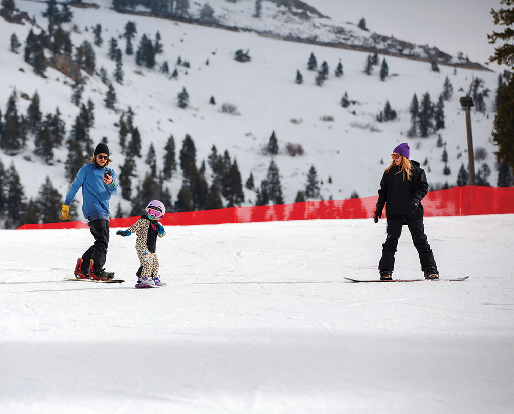 parents and child on the ski slopes