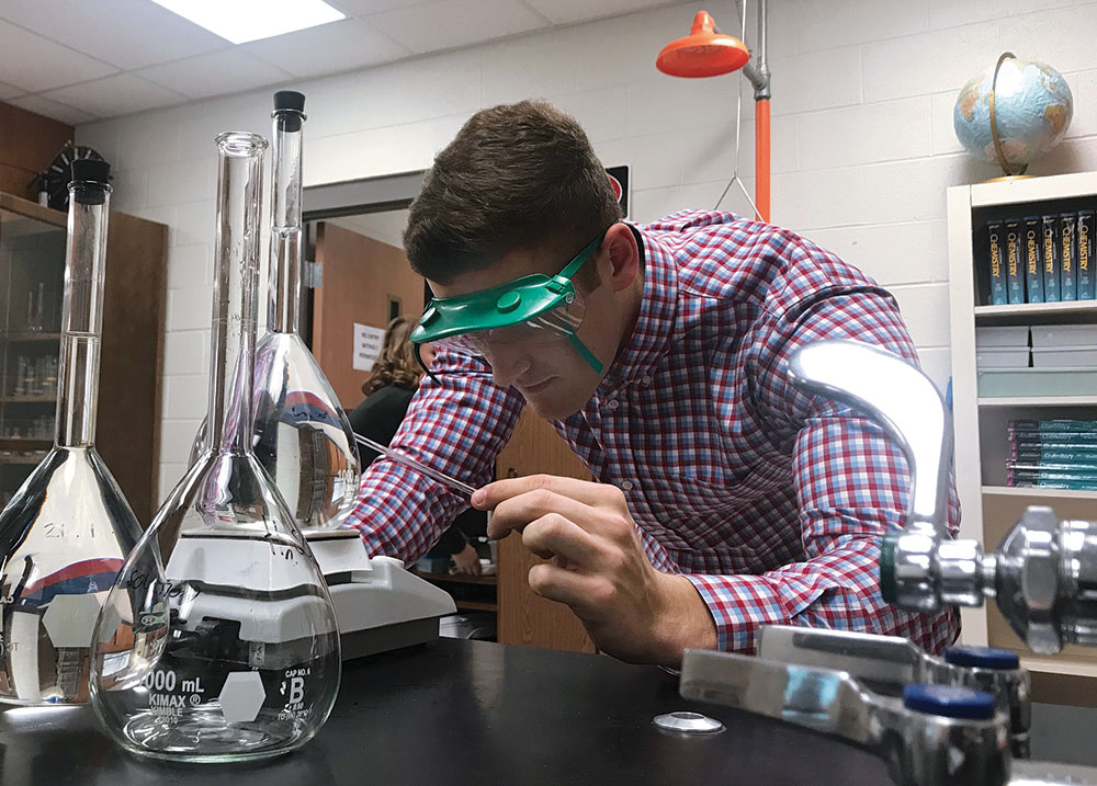 student works on a lab experiment