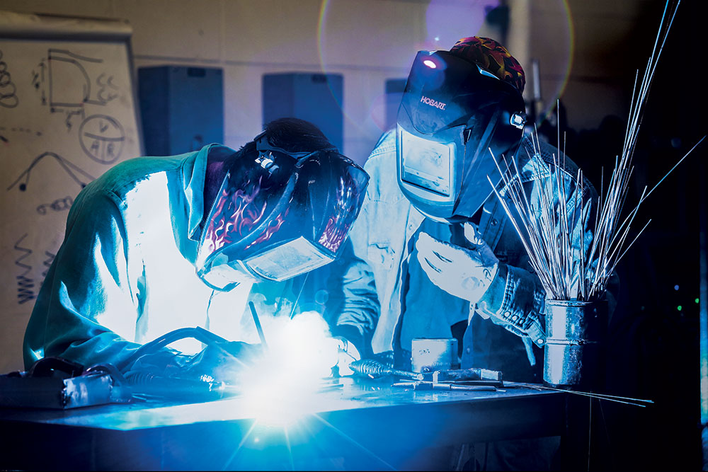 students welding