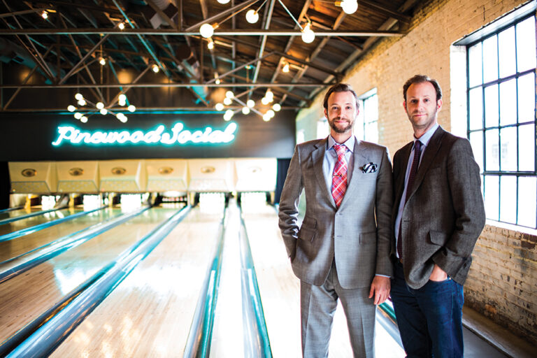 Benjamin and Max Goldberg, the brothers behind Nasvhille’s Strategic Hospitality Consultants, pose in front of the bowling alley at Pinewood Social