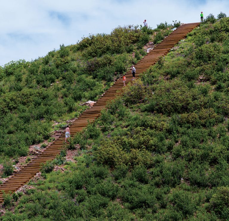 people walk the numerous steps of Challenge Hill
