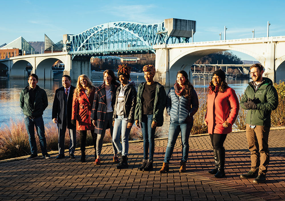 group standing in front of bridge