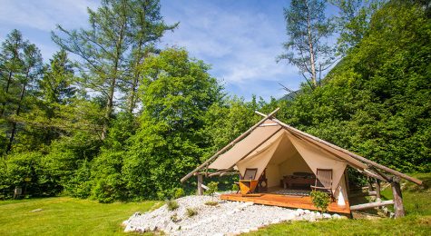 Glamping tent exterior with all amenities in Adrenaline Check eco camp in Slovenia.