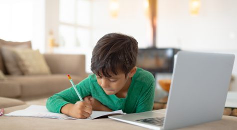 boy using laptop to study
