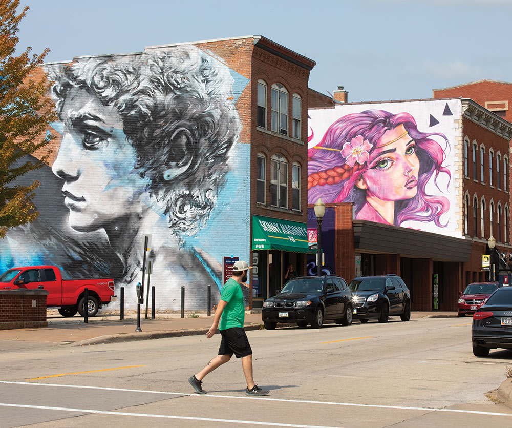 “Young David,” left, and “Wild Rose” murals in downtown Dubuque, IA