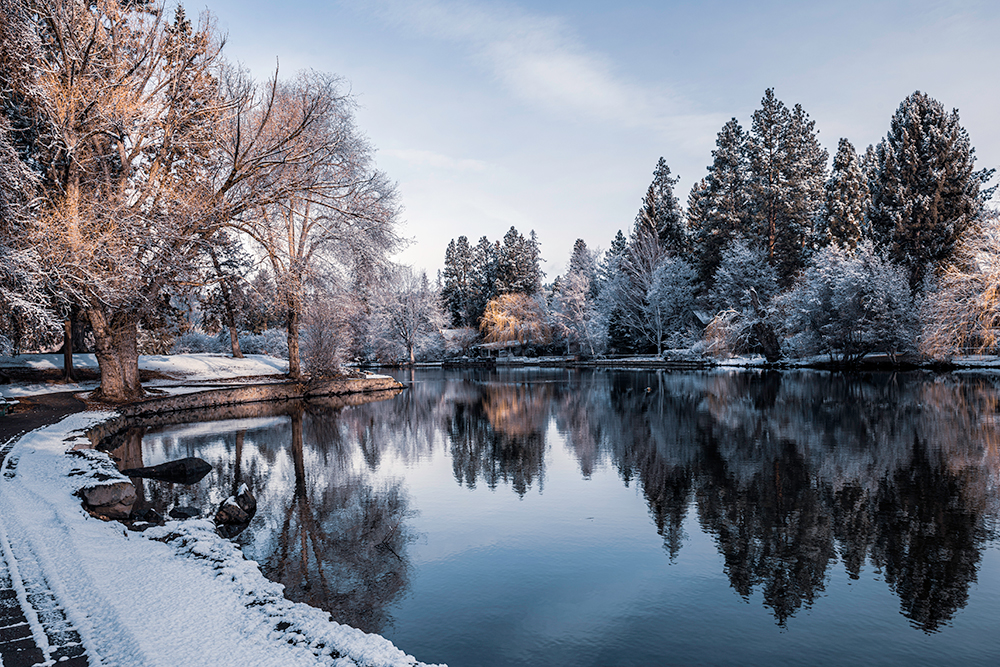 Early morning in the winter on Mirror Pond on the Deschutes River as it flows through Bend, Oregon.