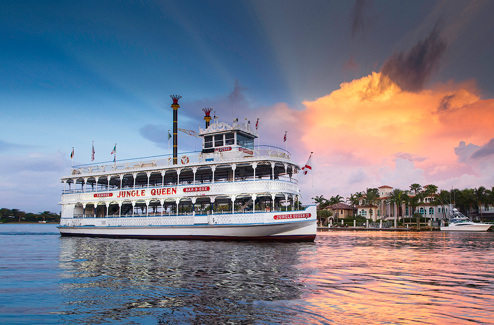 The Jungle Queen Riverboat cruising past mansions in Fort Lauderdale, FL