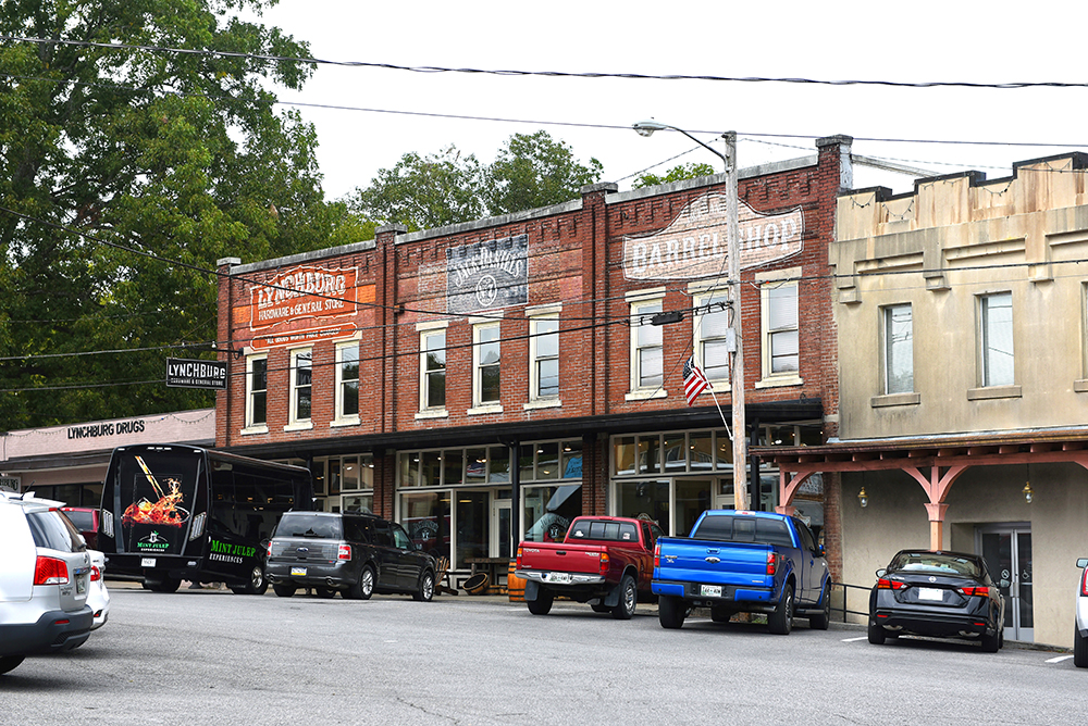 Lynchburg, TN, USA - Drug store, Lynchburg Hardware and General Store, Jack Daniels and Barrel shop in the traditional commercial block close to the Jack Daniels Distillery.