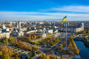 Aerial view to highest ukrainian flag in flagpole on embankment of Lopan river in Kharkiv, Ukraine