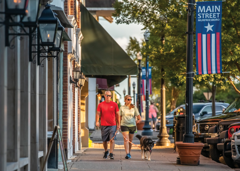 Visitors walk past Puckett's Grocery and Restaurant in downtown Murfreesboro, Tennessee.