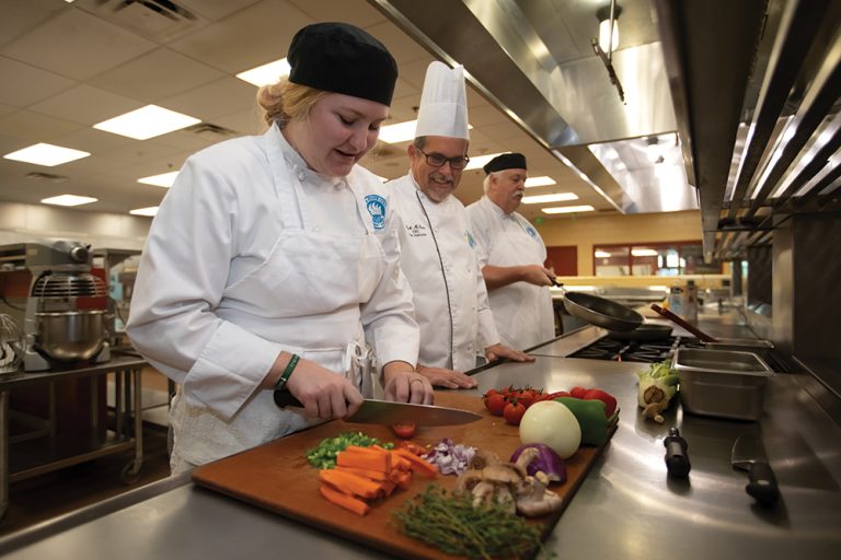 Abigail Killian prepares food in the kitchen at the Mori Hosseini College of Hospitality and Culinary Management on the Daytona State College campus in the Greater Daytona Region. ©Journal Communications/Nathan Lambrecht