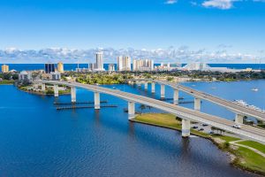Drone angle view of Daytona Beach skyline and bridges over the intracoastal waterway.