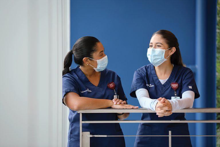 Stock image of two masked nurses at work.
