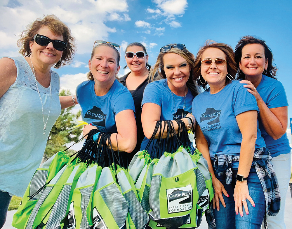 Castle Rock, CO: Group of women with bags supporting the Castle Rock Parks & Trails Foundation