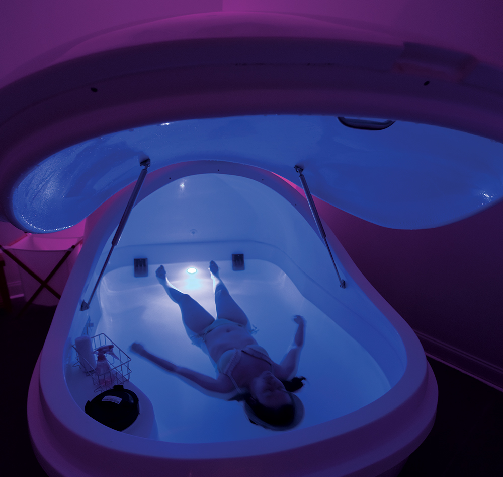 A guest relaxes in a float tank at Float Robins in Warner Robins, Georgia, which is part of the Robins Region.