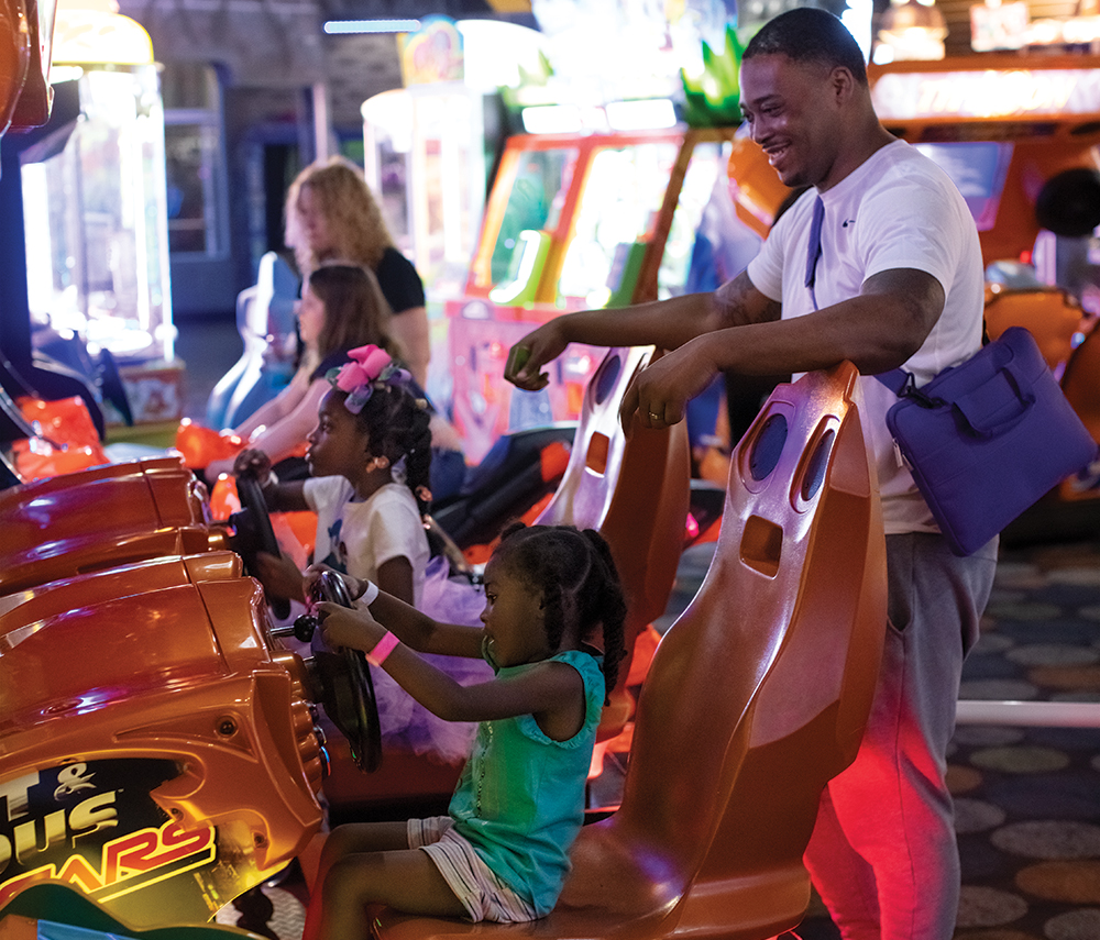 Families play video games in the arcade at the Rigby's Entertainment Complex in Warner Robins, Georgia. ©Journal Communications/Jeff Adkins