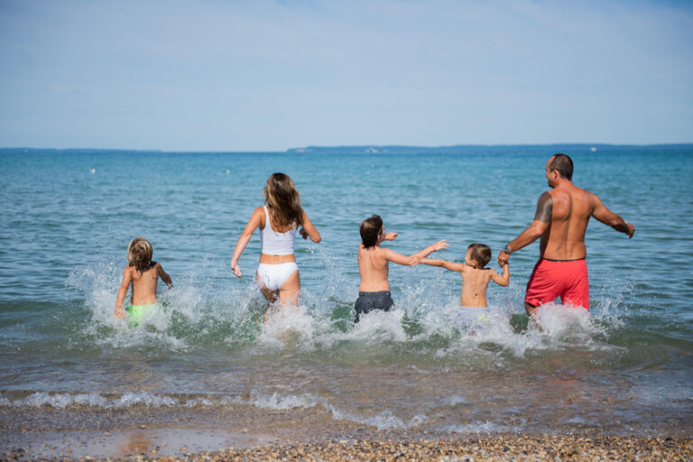 Family at the beach in Traverse City, MI