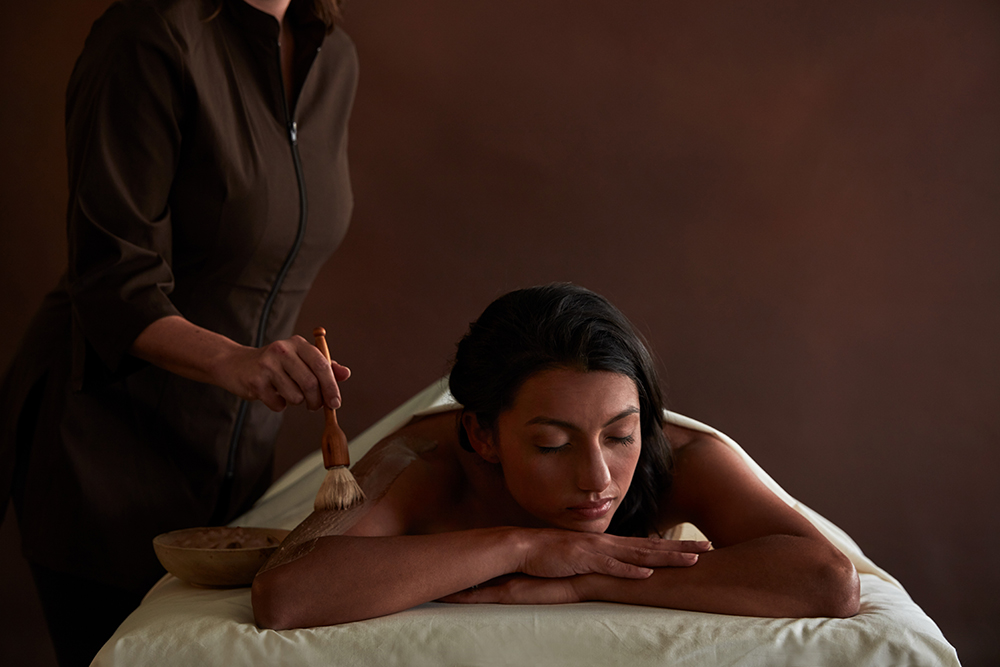 Woman gets a cocoa massage at The Spa at the Hershey Hotel in Hershey, PA.