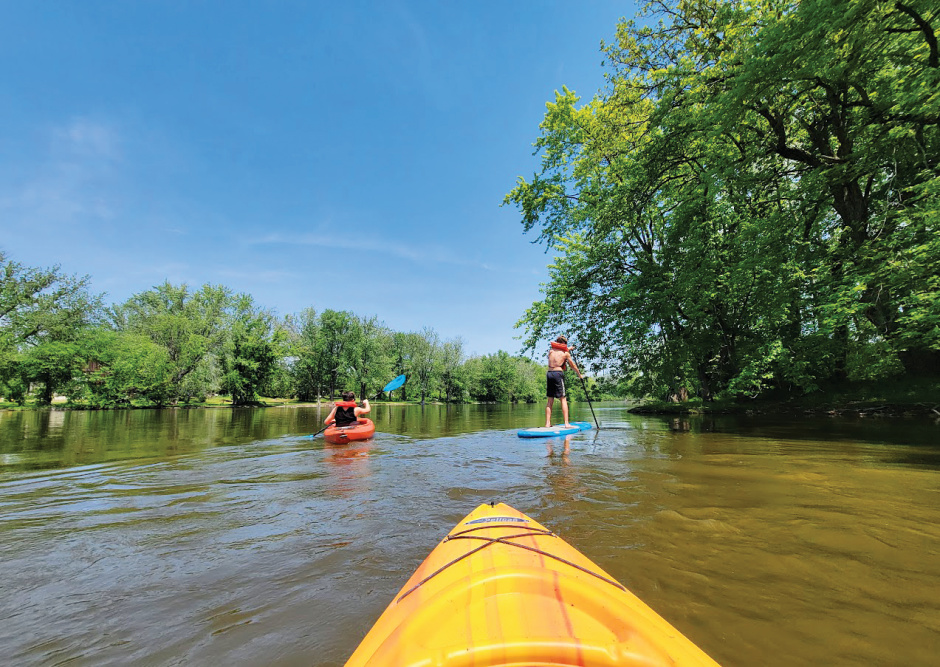 Photos of people on kayaks and paddleboards floating along the Rock River, which is located in the Greater Madison Region.