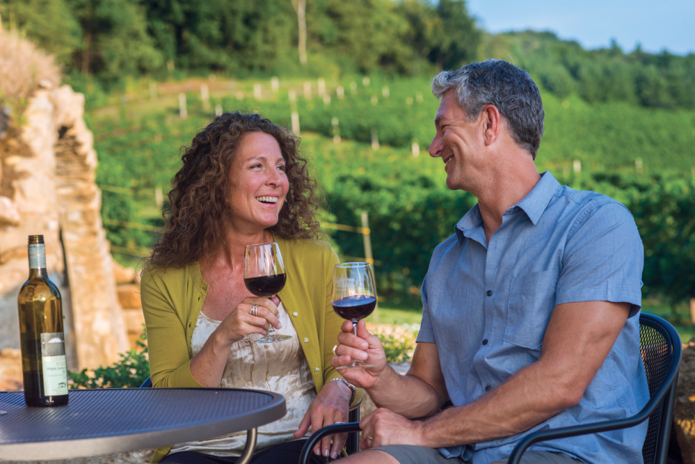 Couple enjoys a glass of wine at the Wollersheim Winery, which is located in the Greater Madison Region.