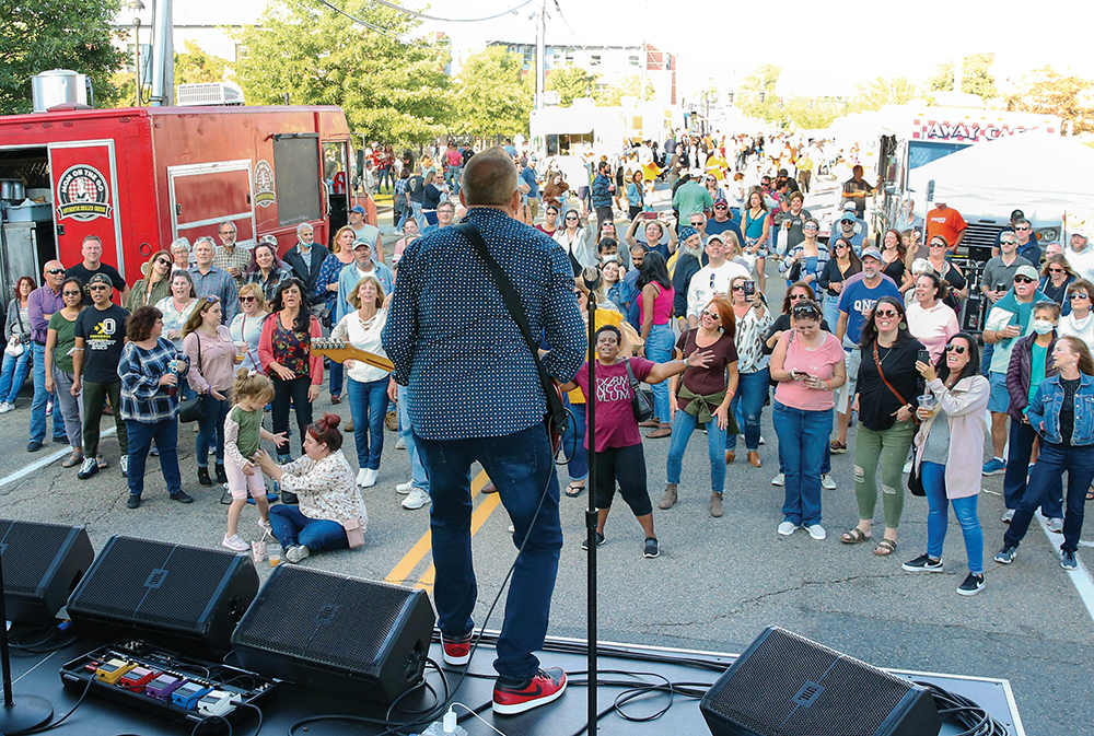 A band plays for a crowd at Foodtruck Fest in Quincy, Massachusetts.