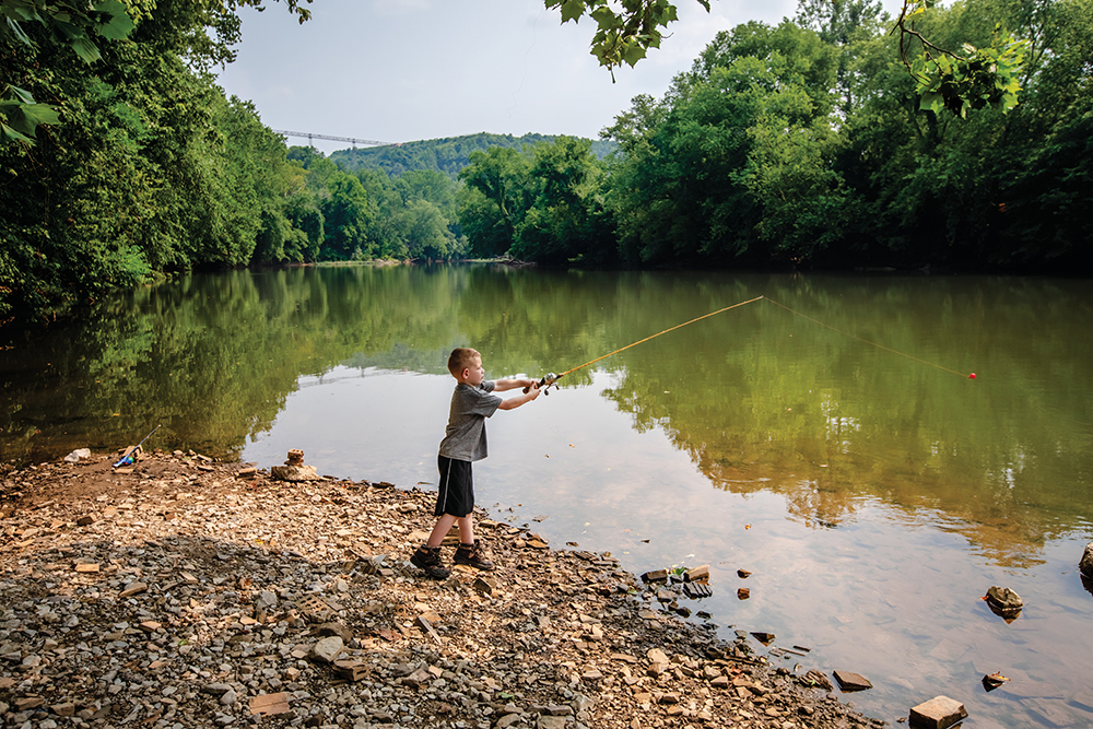 Young visitors fish in the Elk River at Coonskin Park in Charleston, West Virginia. Charleston is located in the Advantage Valley region of West Virginia.