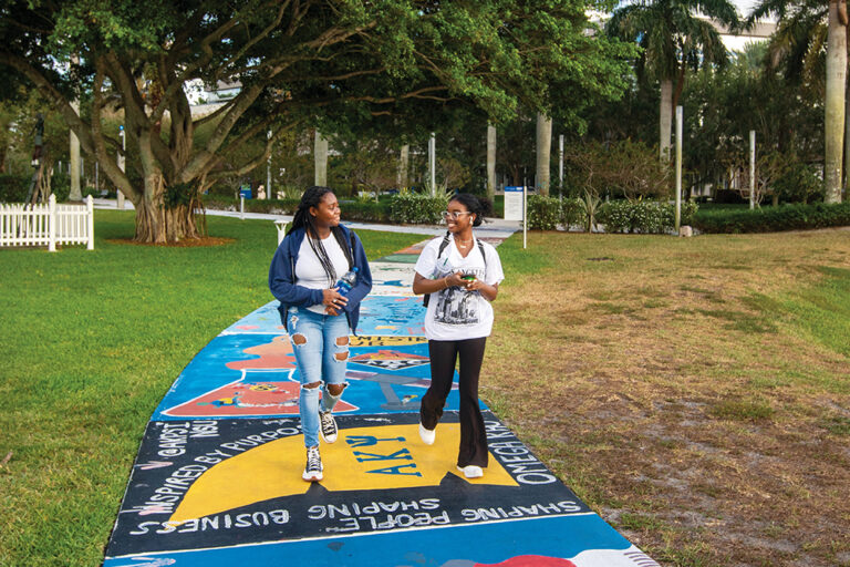 Students walk across the campus of Nova Southeastern University in Fort Lauderdale, Florida.