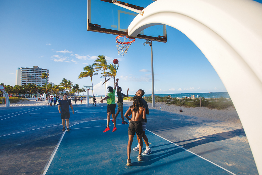 Playing basketball at Fort Lauderdale Beach in Fort Lauderdale, Florida.
