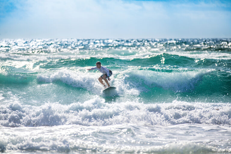 Visitors take advantage of the wind and the waves while surfing in Deerfield Beach, Florida. Deerfield Beach is part of the Greater Fort Lauderdale region.