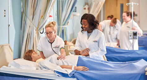 Nurses practice on a dummy at the Bridge Valley CTC, which is located in the Advantage Valley region of West Virginia.